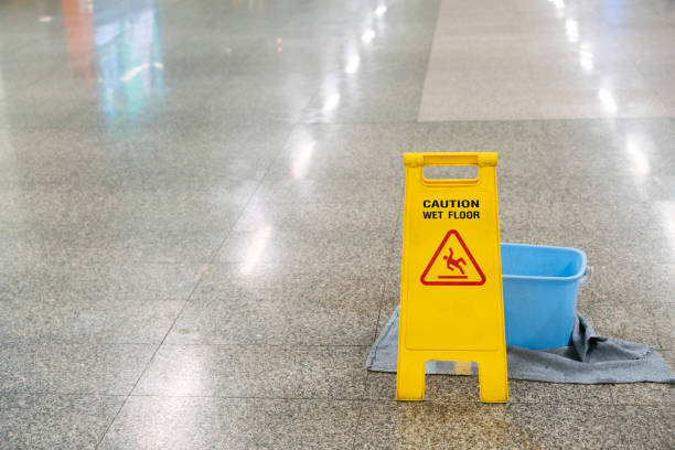 istock cleaning progress caution or warning wet floor sign in office 1250486181