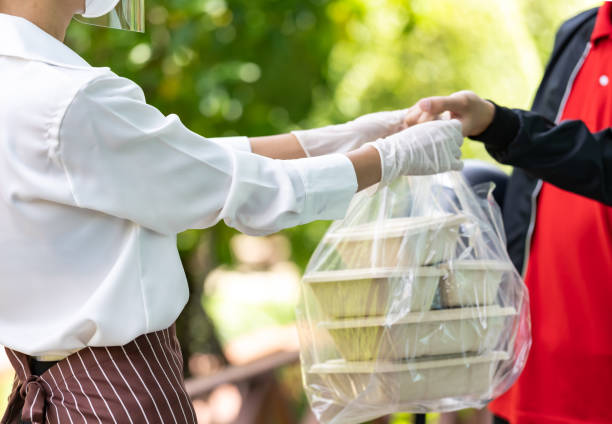 istock Delivery man pick up food order 1250489552