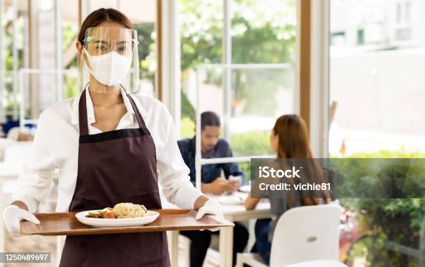 Asian Waitress Serving Food New Normal Stock Photo - Download Image Now - Restaurant, Coronavirus, Protective Face Mask