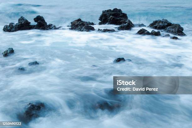 Rocks That Surround The Water Stock Photo - Download Image Now - Beach, Horizontal, Landscape - Scenery