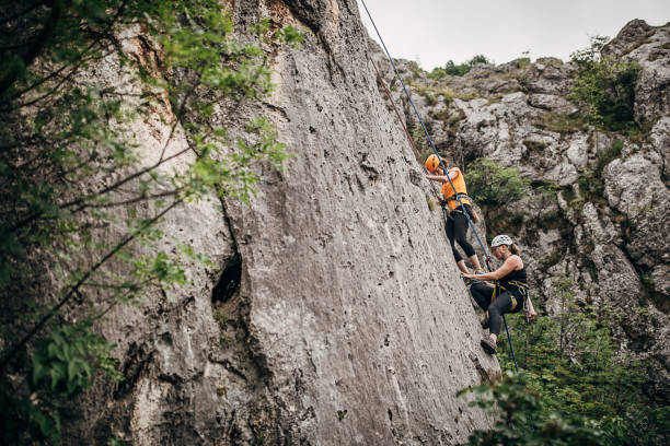 istock Two athletic female rock climbers i nature 1250491507