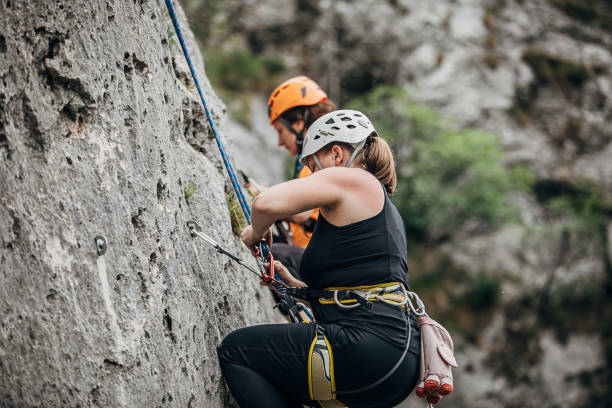 istock Two athletic female rock climbers 1250491542