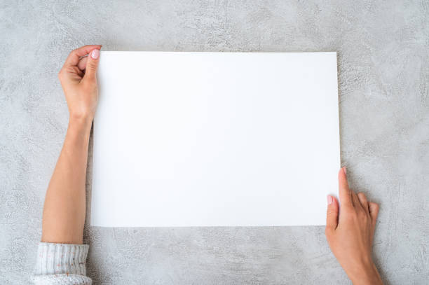istock Girl's holding a paper 1250491848