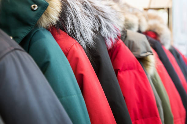 assortment of winter jackets and down jackets stock photo
