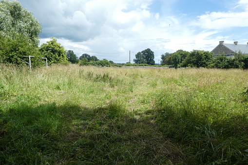 plot in wasteland, pending the construction of a subdivision in village