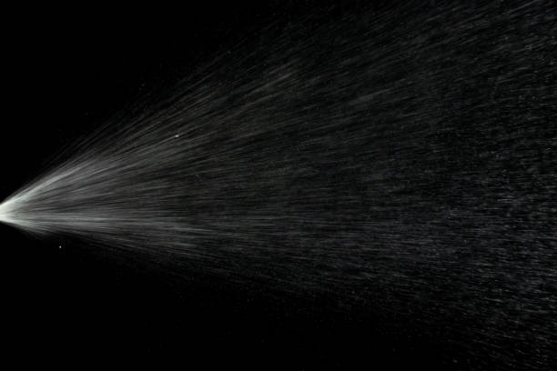 istock Liquid water spray mist from perfume bottle isolated on black. Aerosol splash background. 1250501200