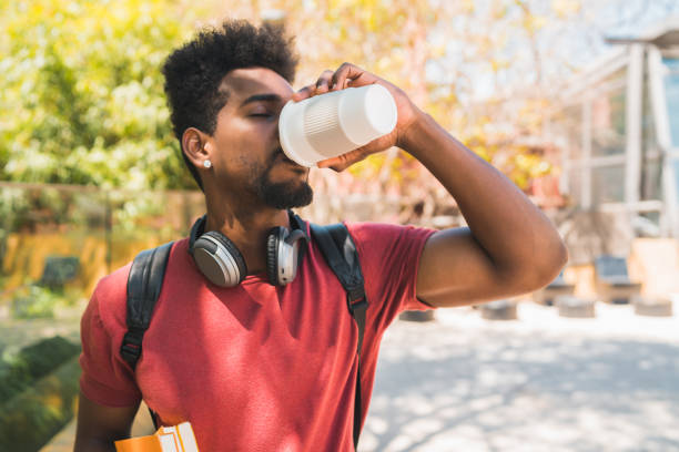 istock Afro university student drinking a cup of coffee. 1250503014