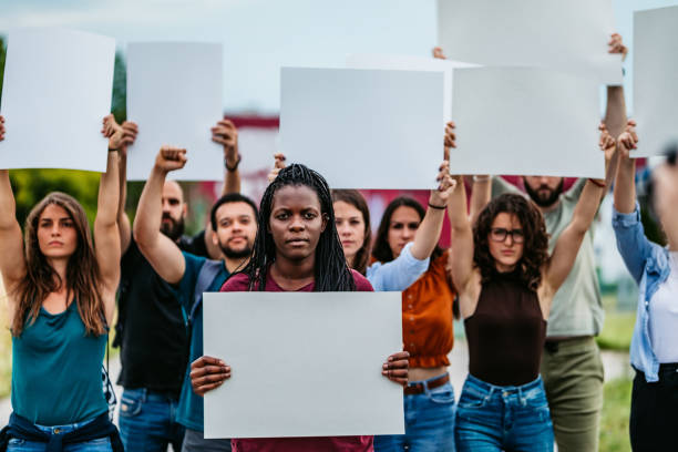 istock Young people protesting at the street 1250504270