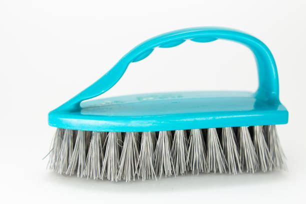 istock plastic cleaning brush on a white background 1250505627