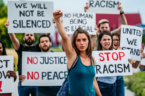 People with placards and posters on global strike against racism.