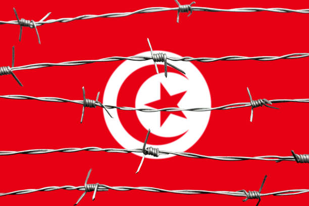 Tunisian Flag and barbed wire. Immigration concept. Border security.