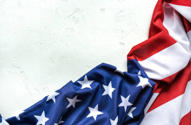 istock Top view of American Flag on white concrete background with  copy space. 1250506861