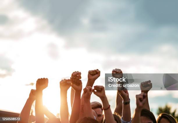 Protestors Raising Fists Stock Photo - Download Image Now - Protest, Human Rights, Togetherness