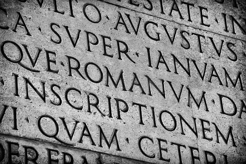 Inscription from Emperor Augustus famous Res Gestae (1st century AD), with the word Romanum in the center