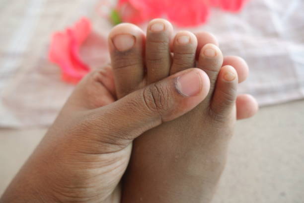 istock A mother pampering her baby's leg 1250508906
