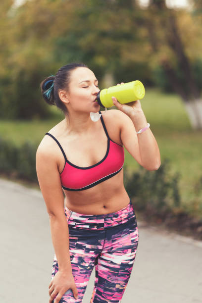 istock runner getting thirsty after the sport 1250509915