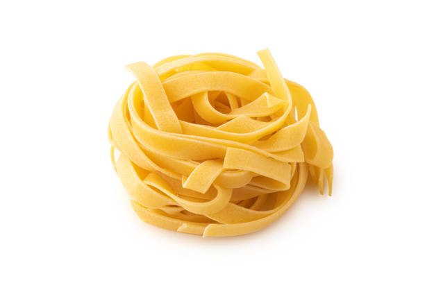 istock Rolled tagliatelle shape of italian pasta on whte background isolated 1250510258