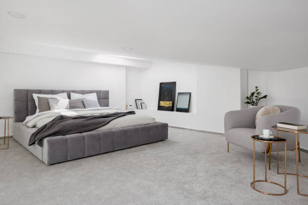 istock Attic bedroom with big bed 1250511187