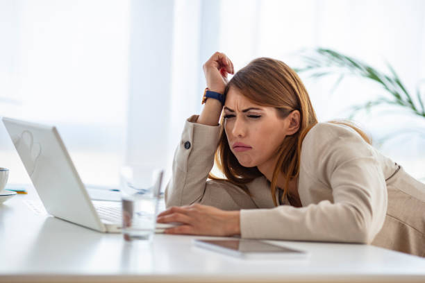 istock Stressed female corporate employee having migraine 1250511562