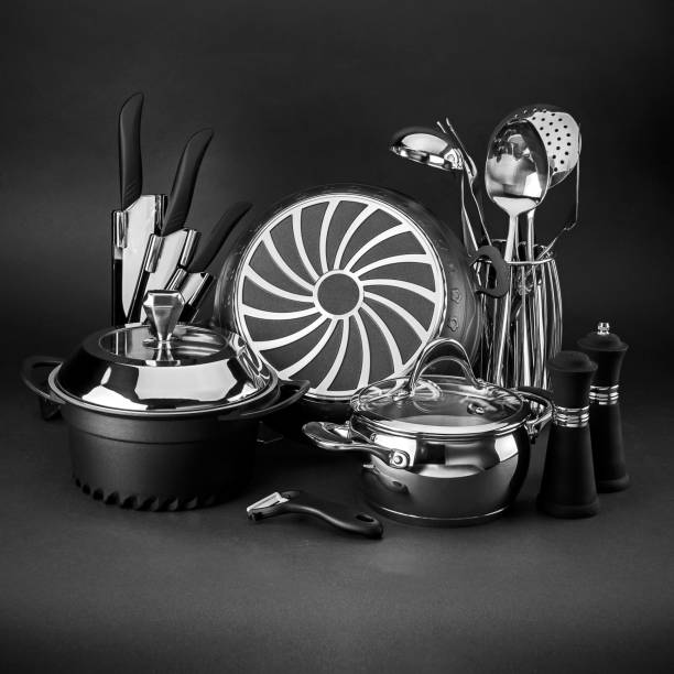 Set of kitchen utensils at the black background