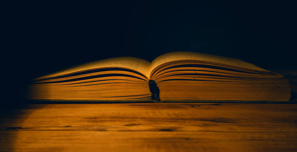 istock open book on the wooden table 1250514332