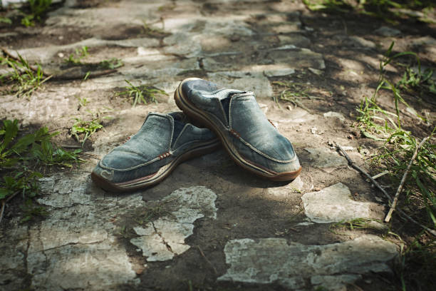 istock Old shoes. Retro background. dirty shoes. 1250514388