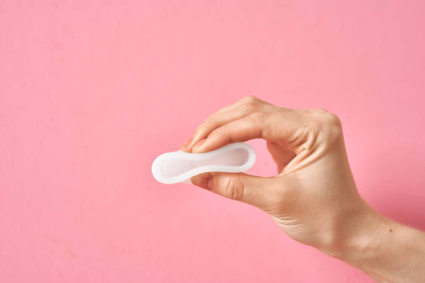 istock Menstrual cup eco friendly reusable and silicone in woman's hand isolated on a white background 1250514732