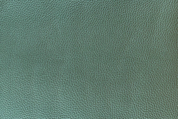 istock Light green letahre texture background. meduim grain 1250515309