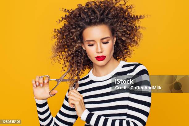 Closeup Photo Of A Beautiful Girl Holds Hair Scissors And Ready To Change Her Hairstyle Stock Photo - Download Image Now