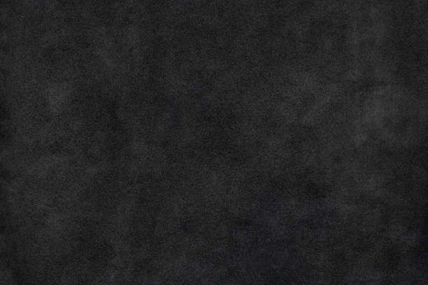 istock Old black natural suede leather soft touch textured background 1250515403