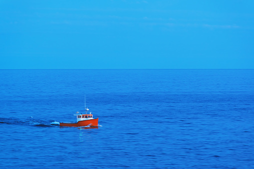 A small cape islander fishing boat heads back to home port.