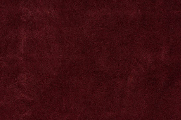 istock Texture background from burgundy leather suede. seamless 1250515511