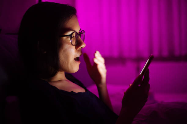 istock Woman laying in bed and using smart phone 1250516653