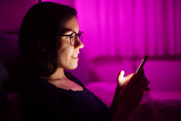 istock Woman laying in bed and using smart phone 1250516776