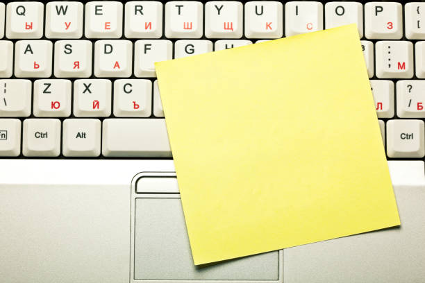 istock Clear Yellow Sticky Note On Laptop Keyboard 1250516920