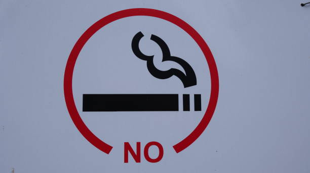 istock No smoking sign on gray background 1250518109