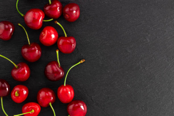 istock cherry on dark background with copy space. Top view. Flat lay 1250518180