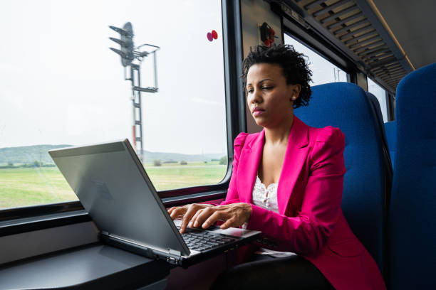 istock Business woman traveling with train 1250520079