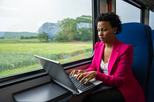 istock Business woman traveling with train 1250520083