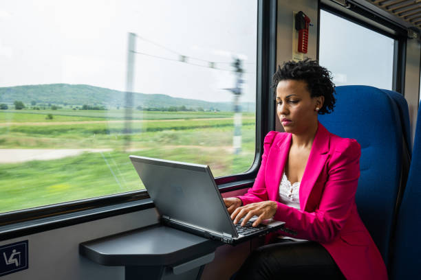istock Business woman traveling with train 1250521241