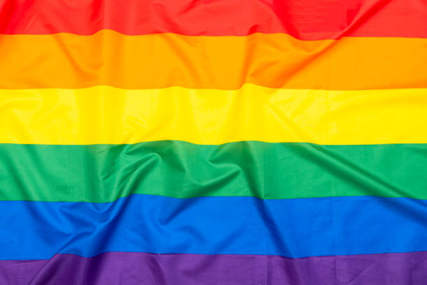 lgbt regenboogvlag, stof homo, lesbische vlag als achtergrond of textuur - queer flag stockfoto's en -beelden