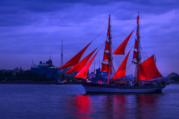 istock Ship with scarlet sails in Neva river on city view background 1250521362