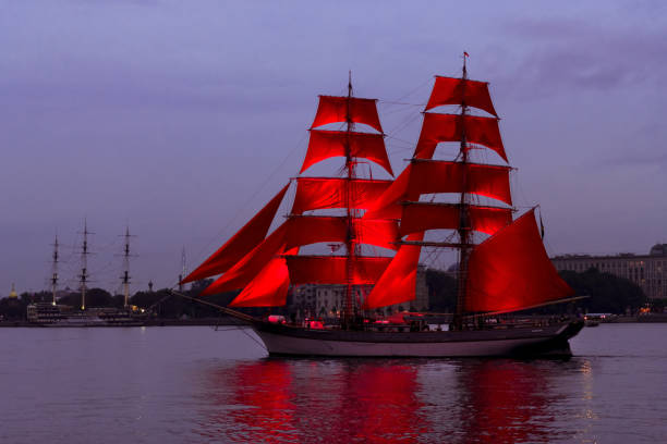 istock Ship with scarlet sails in Neva river on city view background 1250521410