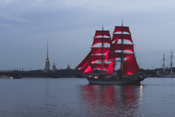 istock Ship with scarlet sails in Neva river on city view background 1250521411