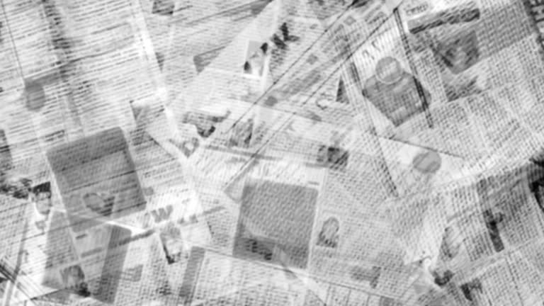 Abstract Animation of Blurred Newspaper Pages with Headlines and Articles Shown in Random Order