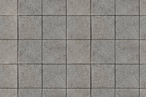 正方形の形状のモダンなテクスチャ舗装タイルでコーティング。 - stone paving stone patio driveway ストックフォトと画像