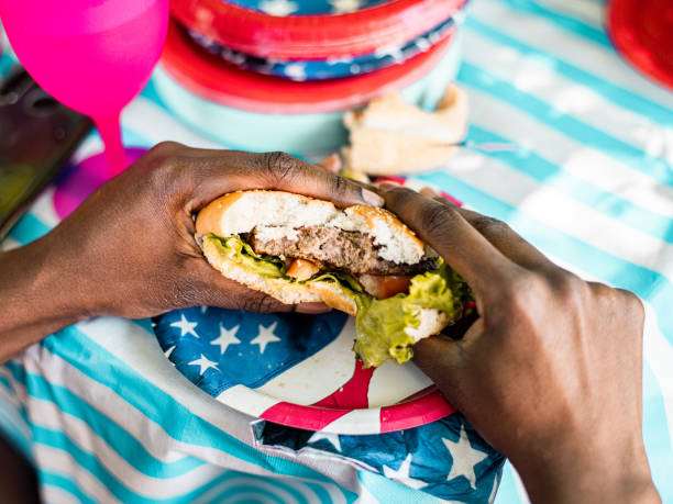 istock Enjoying 4th July BBQ hamburger 1250523415