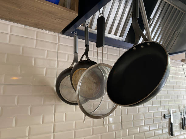 istock cookware sets hanging on the raw concrete polishing wall for every use 1250523763