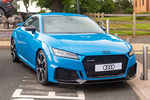 Staffordshire, England - 16 June 2020: A new Audi TTRS on the forecourt at an Audi dealership. The TTRS can accelerate from 0 to 62mph in 4.5 seconds.