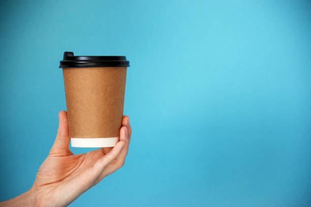 istock Cup of coffee in human hand 1250525829